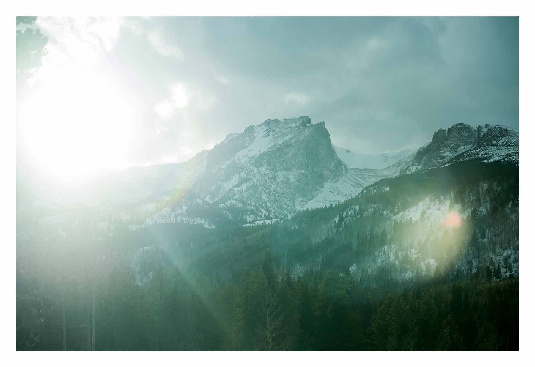 Light reaching past a mountain